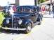1971 Ford Ranchero - Classic black 1939 Ford Coupe on display at an outdoor event.