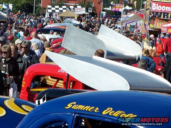 Blue hot rod with yellow lettering "Sumner Jell-O" and red hot rod with large silver fins