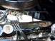 1971 Ford Ranchero - Engine detail with prominent "390" displacement badge and a chrome valve cover with an eagle emblem.