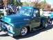 1971 Ford Ranchero - Custom 1956 Ford F-100 pickup truck at an outdoor car show.