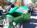 1971 Ford Ranchero - A line of vehicles, including a green hot rod, are displayed outdoors at an event.