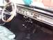 1971 Ford Ranchero - The dashboard features a horizontal speedometer and various knobs and buttons for controls.