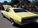 1971 Ford Ranchero - This yellow coupe utility vehicle, likely a 1970 model, is shown from the rear with "Ranchero" badging visible on the fender.