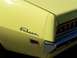1971 Ford Ranchero - Close-up of a yellow Ford Falcon's rear end, showing the 'Falcon' script and taillight assembly.