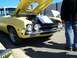 1971 Ford Ranchero - Front view of a yellow 1970 Ford pickup truck with hood open, displaying a sign.