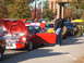 1971 Ford Ranchero - Several classic and modern cars are lined up on a sunny day, with people milling around.