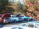 1971 Ford Ranchero - A light blue 1967 Ford Ranchero convertible is displayed with its hood open, alongside other classic vehicles at an outdoor event.