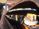 1971 Ford Ranchero - The engine bay of a classic car is open, revealing a V8 engine with custom modifications and several canisters.