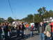 1971 Ford Ranchero - A crowd gathers around a classic black car with its hood open at an outdoor event, likely a car show.