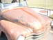 1971 Ford Ranchero - This old truck's hood shows significant rust and peeling paint, with a faded pinstripe design.