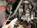 1992 Ford Bronco - Close-up view of engine bay components, including hoses and electrical connectors.