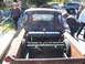 1971 Ford Ranchero - A weathered pickup truck with a custom air tank in the bed is viewed from the rear.