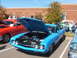 1971 Ford Ranchero - A bright blue pickup truck is displayed with its hood open, revealing the engine compartment.