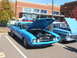 1971 Ford Ranchero - A blue Ford Ranchero from the early 1970s is displayed with its hood up at an outdoor car show.