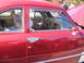 1971 Ford Ranchero - Interior view of a classic red car, showing dashboard, steering wheel, and door panel.