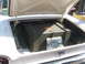 1971 Ford Ranchero - A magazine 1961 Ford models is placed next to a large wooden crate in the trunk of a car.
