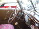 1971 Ford Ranchero - The dashboard of a classic car features a prominent steering wheel and ribbed ventilation grilles.