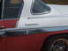 1971 Ford Ranchero - Detail of a two-tone vehicle chrome trim and "Commander" badging on the side panel.