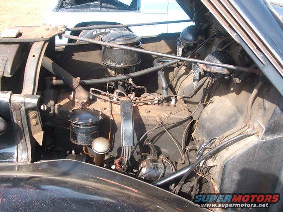 Engine bay with V8 engine, air cleaner, and wiring