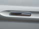1971 Ford Ranchero - A close-up of a 'Grand Prix' emblem on a white vehicle's body panel.