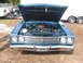 1971 Ford Ranchero - Front view of a 1969 Plymouth Road Runner with the hood open, revealing the engine bay.