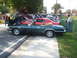 1971 Ford Ranchero - A dark green convertible is parked alongside other vehicles at an outdoor car show.