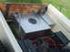 1971 Ford Ranchero - Custom fuel tank and batteries are installed in the bed of a white pickup truck.