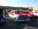 1971 Ford Ranchero - A two-tone red and white classic car is displayed at an outdoor event with other vehicles.