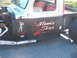 1971 Ford Ranchero - This customized truck features unique artwork on its side, including text and graphics.