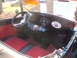 1971 Ford Ranchero - The dashboard of a modified vehicle features a skull ornament and a vintage-style steering wheel.