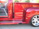 1971 Ford Ranchero - A red pickup truck is shown from the side, custom wheels and chrome trim.