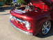 1971 Ford Ranchero - Customized red truck front end with a prominent chrome grille and exposed engine components.