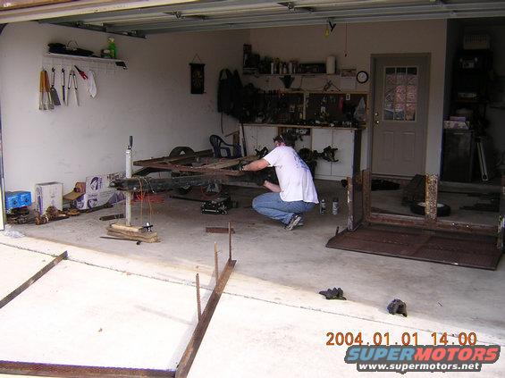Trailer frame being worked on in a garage