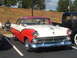 1971 Ford Ranchero - This two-tone red and white 1955 Ford Fairlane Crown Victoria coupe features a distinctive bird hood ornament and chrome grille.