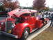 1971 Ford Ranchero - A red tow truck is parked on the side of the road with its hood open, revealing the engine.
