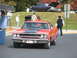 1971 Ford Ranchero - Orange 1970 Plymouth Road Runner parked outdoors, with another classic car in the background.