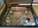 1997 Dodge 3500 - The interior of a stove top, four burners covered with aluminum foil for protection.