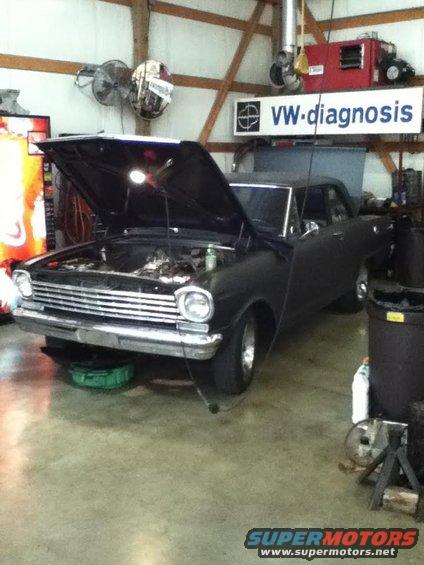 1963 Chevrolet Nova with hood open in a garage