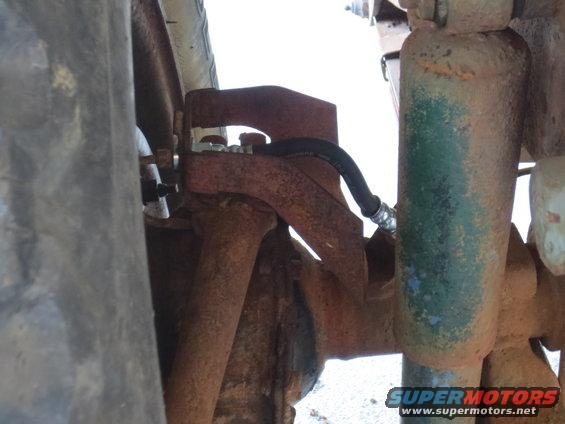 Wheel cylinder and brake hose on rusty suspension component