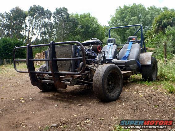 Custom buggy with large bull bar, exposed engine, and racing seats