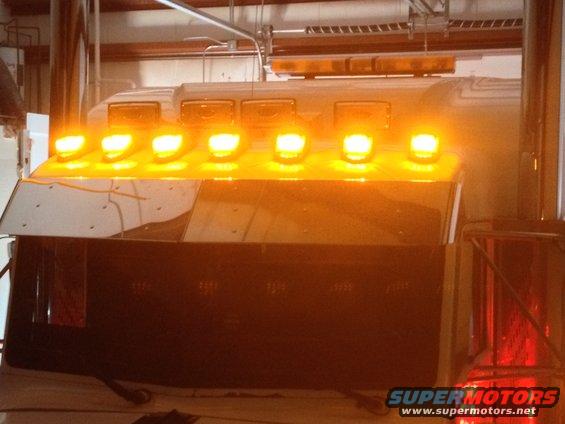 2003 Peterbilt 379 roof with multiple amber lights and a light bar