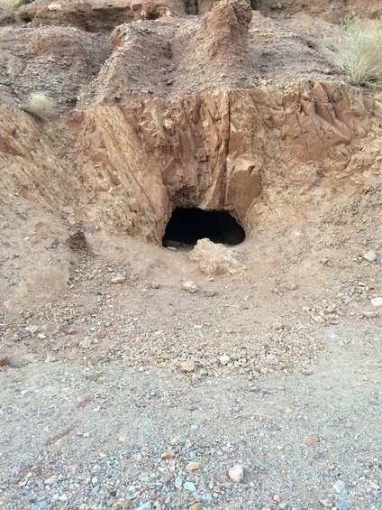 cave entrance in a rocky hillside