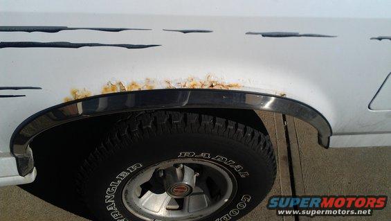 Rust over the rear driver side wheel well