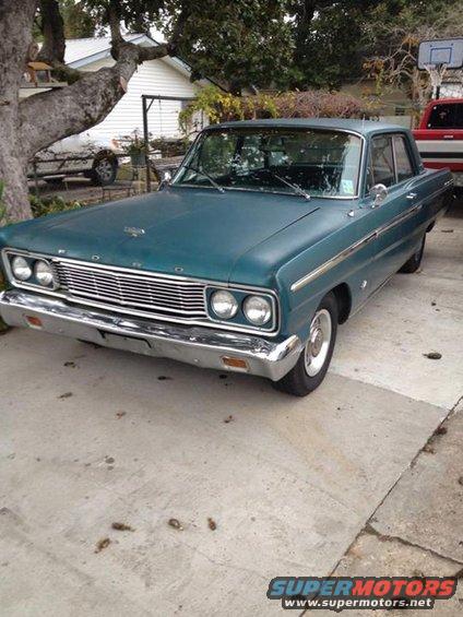 1965 Ford Fairlane sedan, front view, teal paint