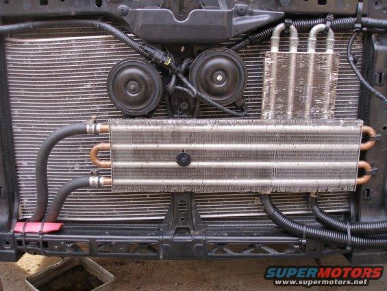 Engine oil cooler and radiator assembly with dual horns