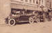 1914 Ford Model T - A line of vintage automobiles is parked along the curb in front of businesses, including the Hotel James and Columbus Cafe.