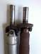 1999 Mercury Grand Marquis - Comparison of two driveshafts, one appearing newer and the other showing significant rust.