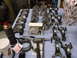 1967 Ford Mustang - Various engine components are organized on a workbench, suggesting an engine rebuild or assembly process.