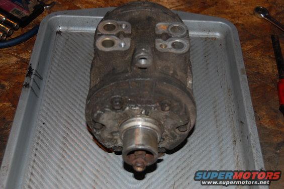 FS 6 A/C compressor removed from a 1985 Ford Bronco. This compressor was removed during an engine swap because it was seized. The clutch, pulley, and coil have already been removed.