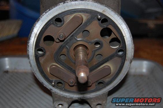Close-up of a compressor part with a metal shaft and internal components